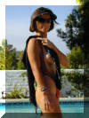 The Monte Carlo topless thong one piece enhances the bustline
